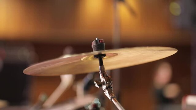 musical cymbal closeup shot. musical cymbal on a blurred background, bokeh. drum set as musical background. Drum set, drum kit, musical cymbal. musical cymbal as musical background.