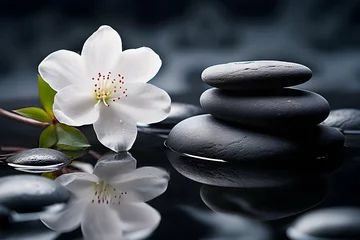 Foto op Canvas Spa and yoga stones with flowers , White orchid and black stones close up. © TERKWAZ
