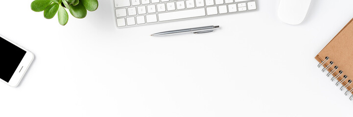 Overhead shot of elegant office desktop with computer and business accessories. Banner