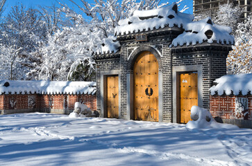 snow on traditional Korean style gates in Seoul National park during winter season (Tashkent,...
