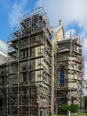 Repair of the facade and roof of an old Lutheran stone church using complicated shaped scaffolding