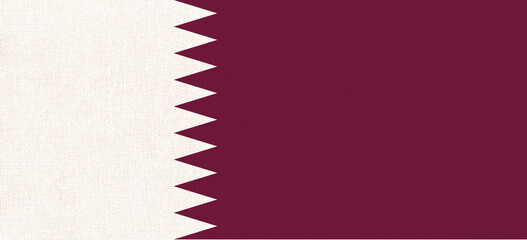 Flag of Qatar on fabric surface. Qatar national flag on texture.
