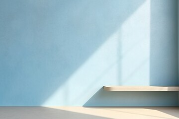 Minimal light blue background for product presentation. Shadow and light from windows on wall.