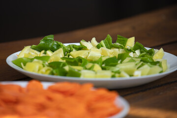 green and yellow pepper on table