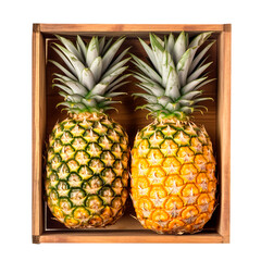 Top view of wooden box with two pineapples over isolated transparent background