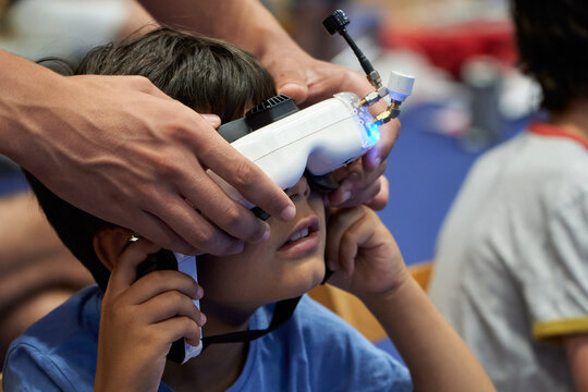 Astonished little boy with VR Drone-Control Goggles