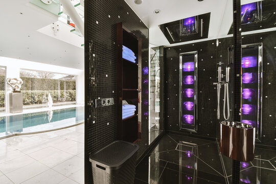 Large black steam room and swimming pool