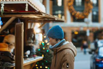Man Shopping at a Christmas Market Stall in Quebec, Canada