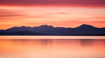 Fototapeta na wymiar Sunset over mountains with lake and background mountains.