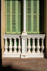 Window with green shutters