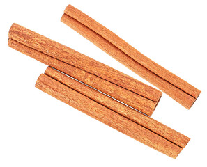 Three cinnamon sticks isolated on a white background, top view.
