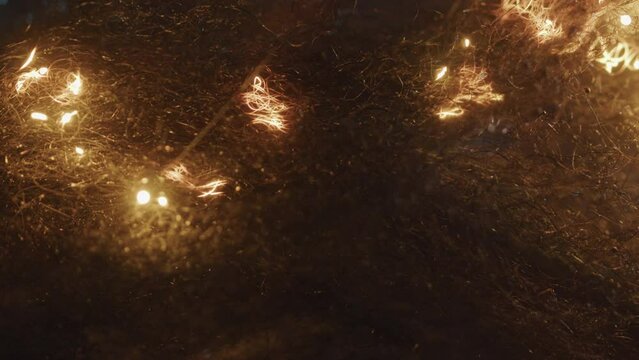 Sparks Move Through. Steel Wool Burning.