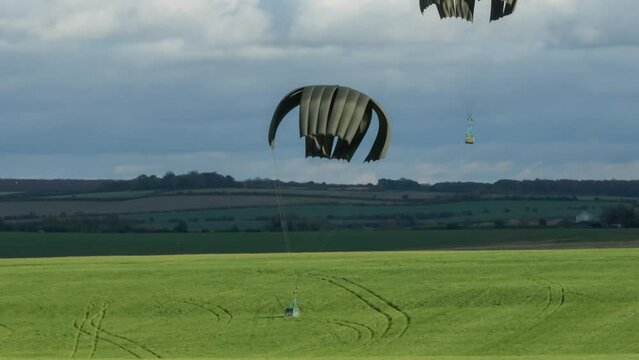 container delivery system parachute drop from ZM415 RAF Royal Air Force Airbus A400M Atlas military cargo plane 