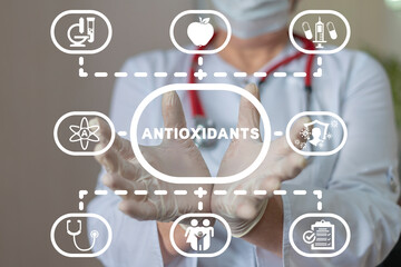 Doctor using virtual interface sees word: ANTIOXIDANTS. Natural Antioxidants Nutrition Diet...