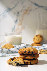 chocolate cookies and milk with kitchen table