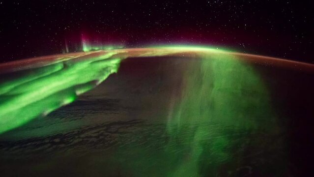 Aurora and Northern Lights over planet Earth seen from space. View from International Space Station. Public Domain images from Nasa