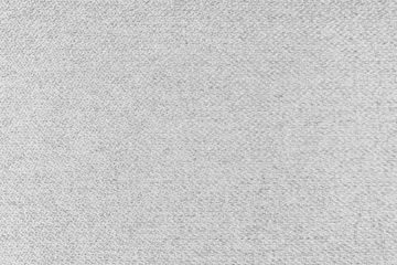 Rolgordijnen Textile background, white coarse fabric texture, jacquard woven upholstery, furniture textile material, wallpaper, backdrop. Cloth structure close up. © katyamaximenko
