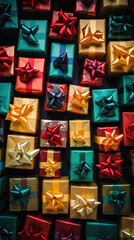 Colorful gift boxes on black background, top view, copy space.