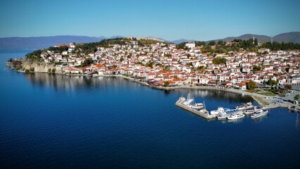 Fototapeta na wymiar Aerial view of the Ohrid cityscape on the lakeshore against a blue sky, in the Republic of Macedonia