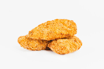 Chicken Breaded Fillet.Fast food. Breaded Chicken Inner Fillet on a White Background,Chicken Breaded Raw Meat. Fast cooking. Breaded chicken nuggets. Homemade food at home.