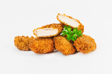Breaded Chicken Inner Fillet, Chicken Breaded Raw Meat. Fast cooking.Breaded Chicken nuggets Fillet with salad on a White Background,food at home. Fast homemade food.Chicken breaded schnitzels.