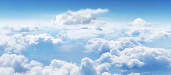 Türaufkleber Traveling by plane observe clouds against a blue sky © Vusal