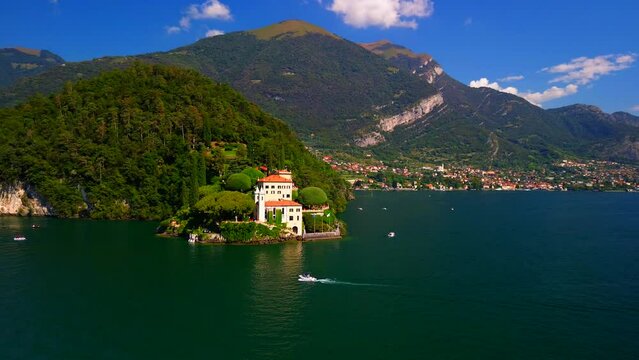 Aerial view of the luxury Villa Balbianello with terraced gardens, on the rocky wooded peninsula of Lavedo on Lake Como, panorama, picturesque residence. Green Planet. Nature. Lenno Italy 10.2023