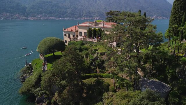 Aerial view of the luxury Villa Balbianello with terraced gardens, on the rocky wooded peninsula of Lavedo on Lake Como, panorama, picturesque residence. Green Planet. Nature. Lenno Italy 10.2023