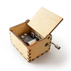 Small hand crank musical box, isolated on white background