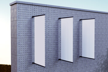 Mockup of Three Vertical Outdoor Banners on a Building Facade with a Clear Blue Sky 