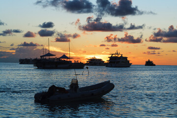 Fototapeta premium Attractive sunset with beautiful and colorful boat