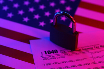 1040 US Individual Income Tax Return form with small locked padlock. Sanctions or blocked tax...