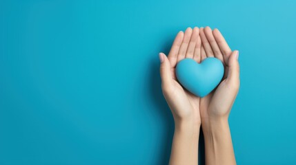 A blue heart held by two hands on a blue background, representing affection and compassion