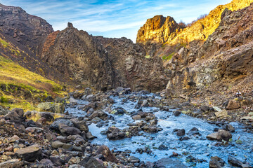 Fototapeta na wymiar flowing river and landscape in the mountains -- Husafell Canyon, Iceland