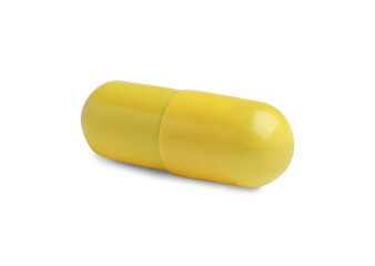One yellow pill isolated on white. Medicinal treatment