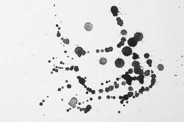 Blots of black ink on white background, flat lay