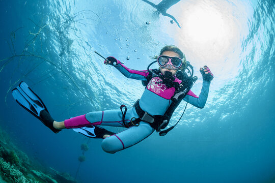 Child scuba diver underwater in the ocean