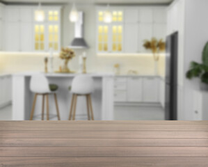 Empty wooden table in kitchen, space for design