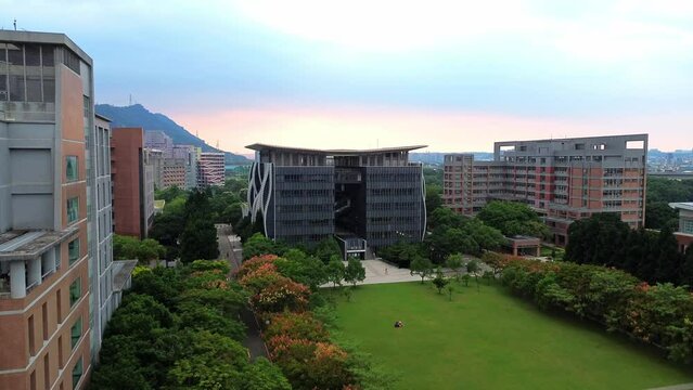 Aerial 4K footage of National Taipei University during sunset. A prestigious university specialized in business and law located in Sanxia District, New Taipei City, Taiwan.