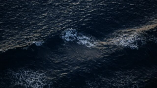 view to the waves rippling on water surface while cruising in the ocea sea in night dar time, wirling water while cruising, wave on sea water surface background
