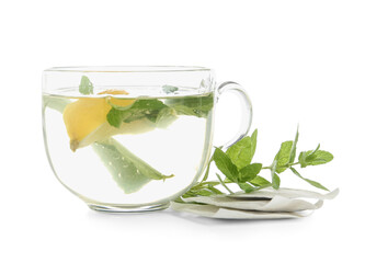 Cup of fresh mint tea with lemon isolated on white background