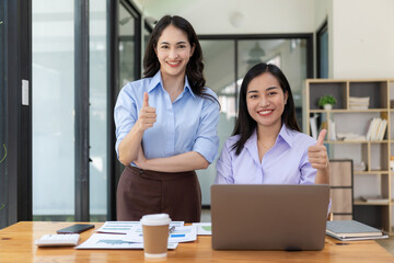 Happy, excited, success in business, Asian woman wins in office, beautiful Asian woman celebrates with laptop. happy success gesture ecommerce