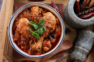 Spicy red chicken curry. Goan style chicken vindaloo. Butter chicken Murgh Makhani curry roast hot...