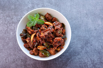 Kerala style beef or Mutton dry fry. delicious spicy Beef fry in clay pot . beef curry for ghee...