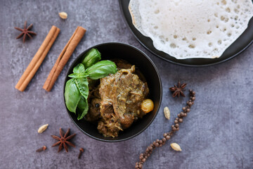A traditional duck curry with appam. Appam or Palappam is one of the most popular and traditional Kerala brakefast bread