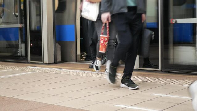 low angle view to the door gate of the subway's door train commuter on platform at train station while  people walk through the door,taiwan public transportation background