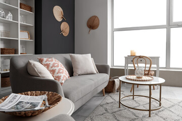 Interior of living room with sofa and tables