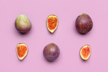 Fresh ripe figs on purple background