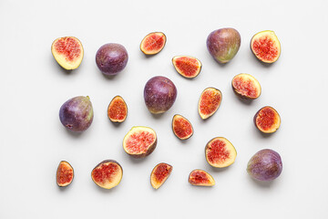 Fototapeta premium Fresh ripe figs on lilac background
