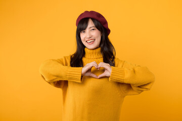 Young Asian woman in her 30s, wearing a yellow sweater and red beret, conveys romance and affection...